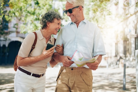 older couple smiles after getting all-on-x denture implants in Oceanside, CA